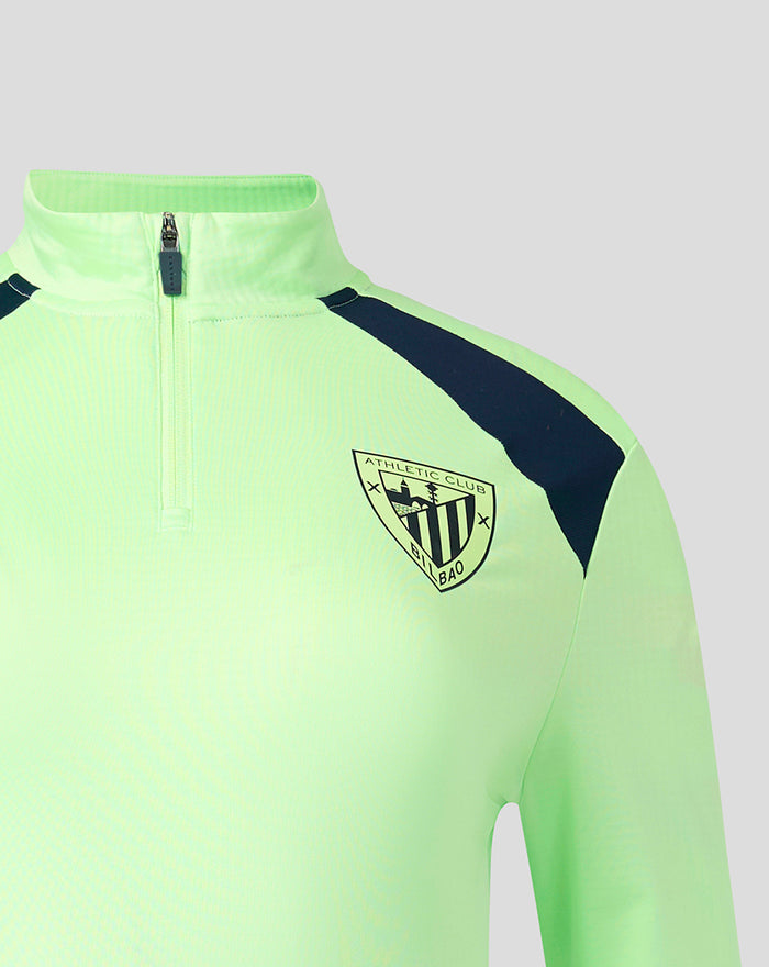 Neon green midlayer top with navy shoulder panel and chest crest logo.