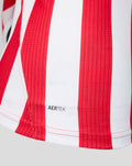 Close-up of red and white striped fabric with ribbed texture on the Athletic Club home shirt showing AERTEK label.