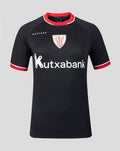 Black away short sleeve women's sports shirt with red trim, crest on chest and Kutxabank sponsor logo across the front.