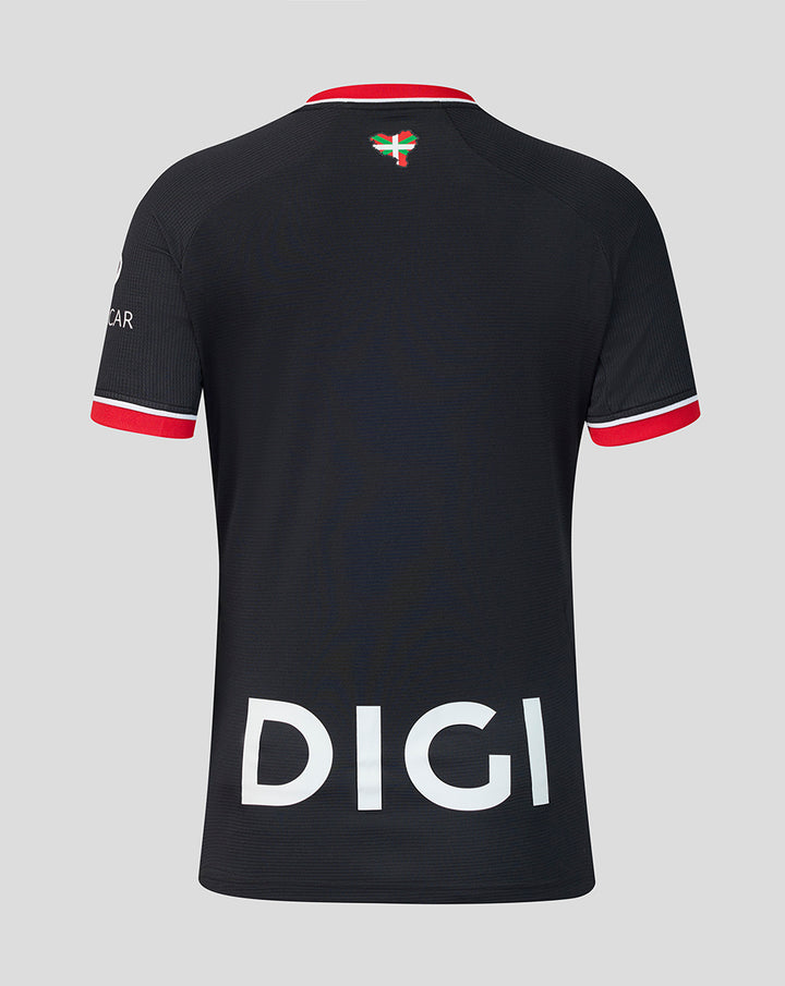 Back view of black away short sleeve shirt with large white DIGI text across the lower back and red sleeve cuffs.