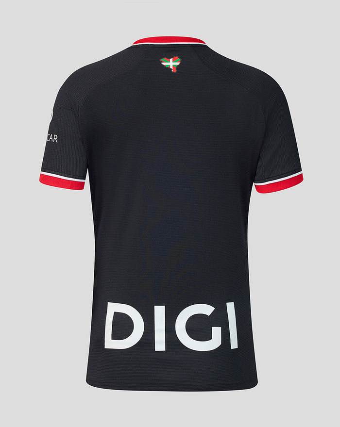 Back view of black away short sleeve shirt with large white DIGI text across the lower back and red sleeve cuffs.