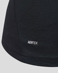 Close-up of black knit fabric with AERTEK branding at the hem of the women's away short sleeve shirt.