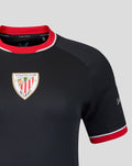 Detail shot of the navy away shirt highlighting the crest on the chest and red sleeve trim
