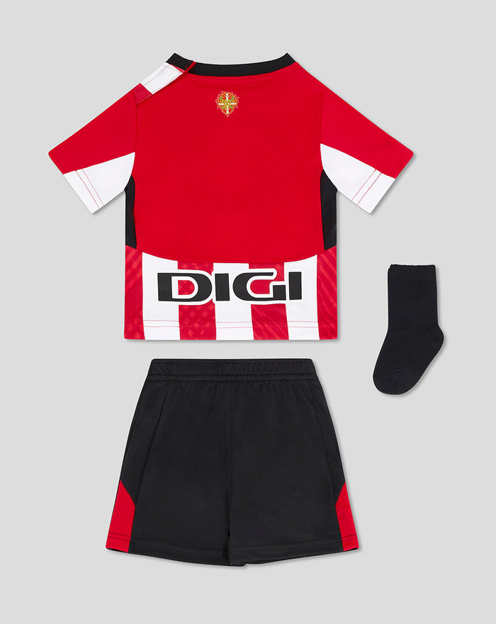 Baby's Athletic Club away nested kit laid out with red jersey featuring a white and red hem pattern, black shorts and a black sock