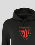Close up of a black Athletic Club hoodie featuring a red crest on the chest and a drawstring hood