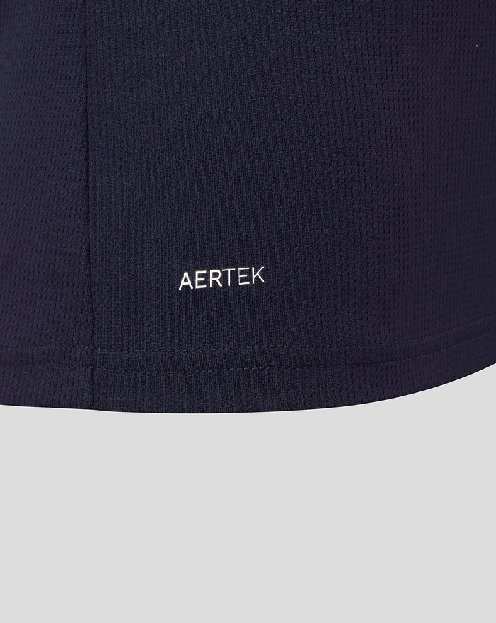 Close-up of navy Athletic Club Away Shirt fabric with AerTek branding at the hem
