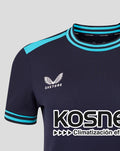 Close-up of navy Kosner shirt featuring turquoise striped collar and cuffs Castore logo and Athletic Club crest patch on chest.