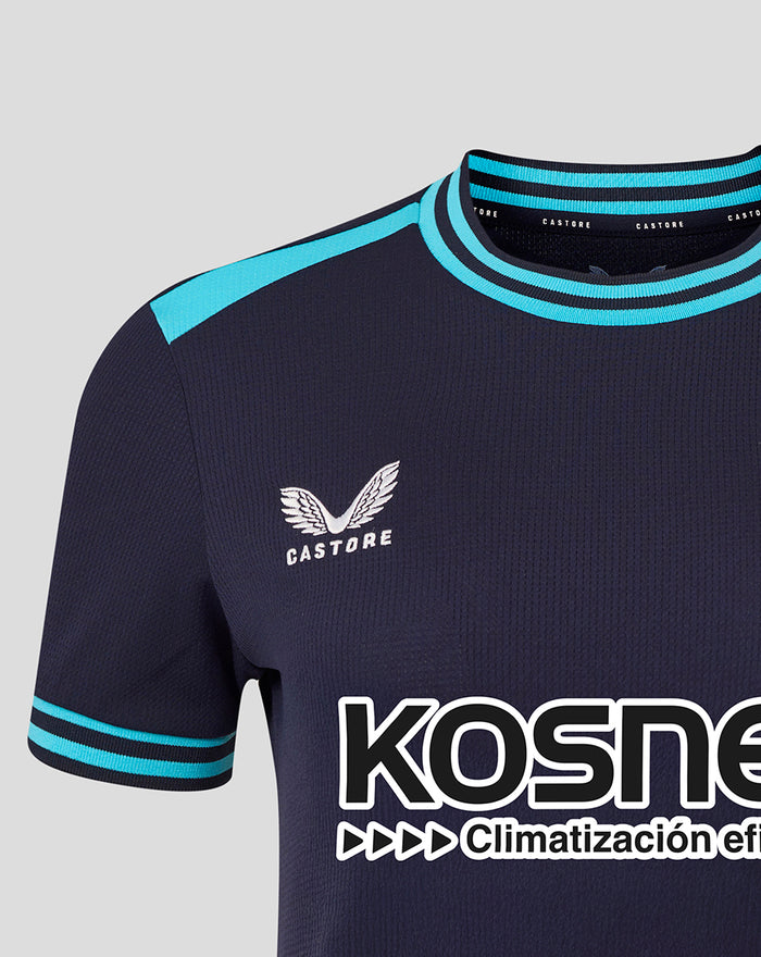 Close-up of navy Kosner shirt featuring turquoise striped collar and cuffs Castore logo and Athletic Club crest patch on chest.