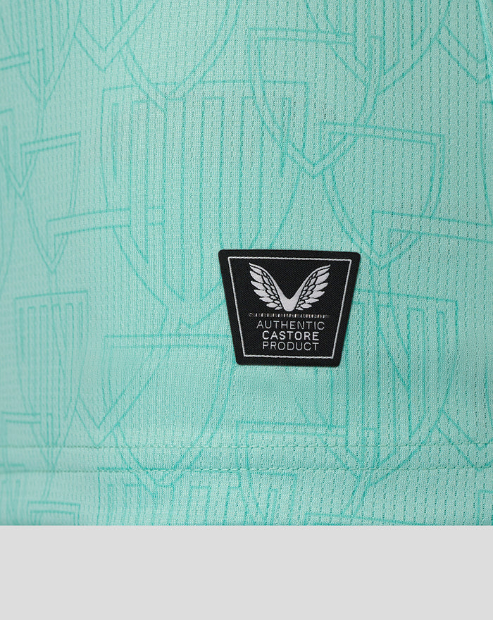 Close up of turquoise AerTek fabric showing a subtle geometric pattern.