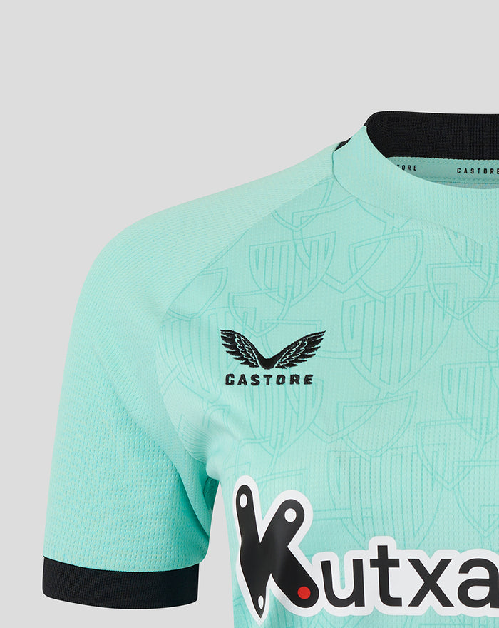 Turquoise Athletic Club shirt close up with Castore logo and Kutxa sponsor across the front.