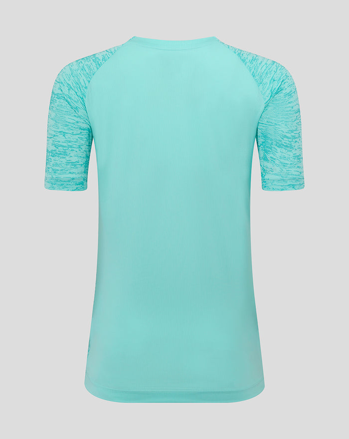 Back view of turquoise Athletic Club women’s short sleeve tee with marled sleeves and dropped hem.