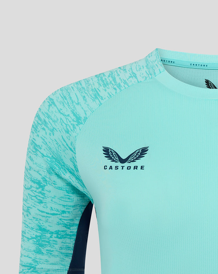 Close-up of the turquoise Athletic Club performance tee front showing Castore logo on the chest.