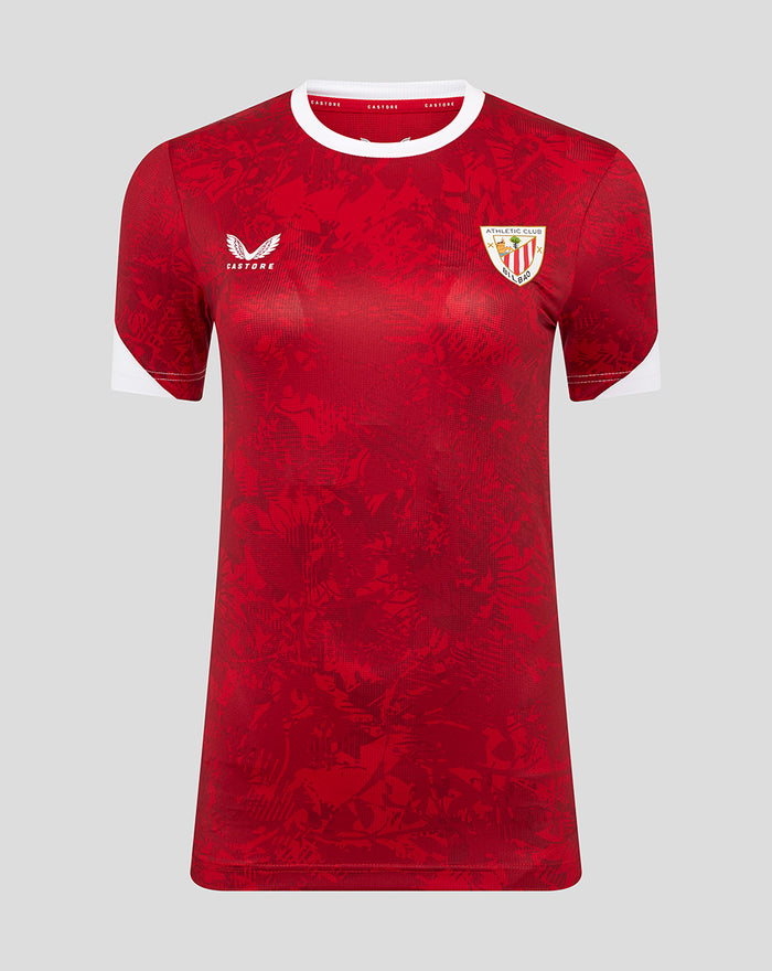 Front view of red Athletic Club home pre match short sleeve tee with white collar and cuffs, Castore logo on the right chest and club crest on the left chest.