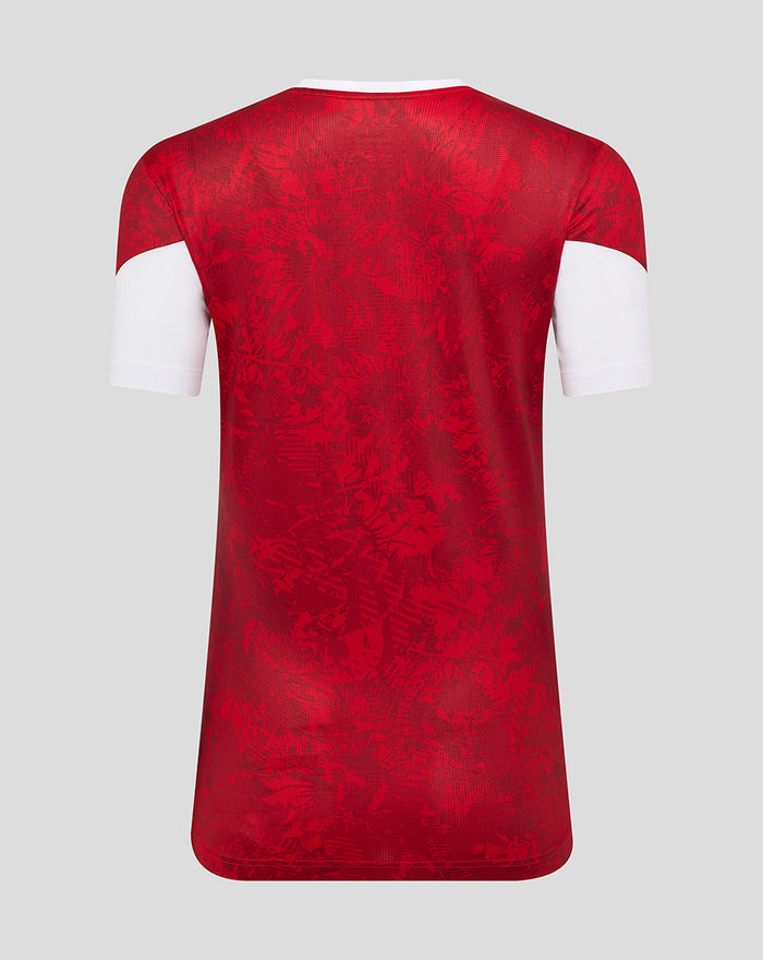 Back view of red floral patterned Athletic Club home pre match short sleeve tee with white sleeve cuffs.