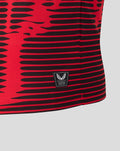 Close up of the Athletic Club 4th kit shirt showing red and black stripes and the authentic Castore product patch near the hem