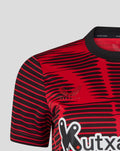 Back view of Athletic Club 4th short sleeve women's jersey with large white DIGI logo across lower back and bold pattern