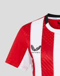 Front close up of the red and white striped women's home shirt with crest on the left chest