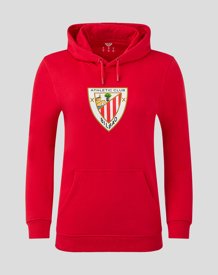 Front view of red women's core hoodie with crest badge