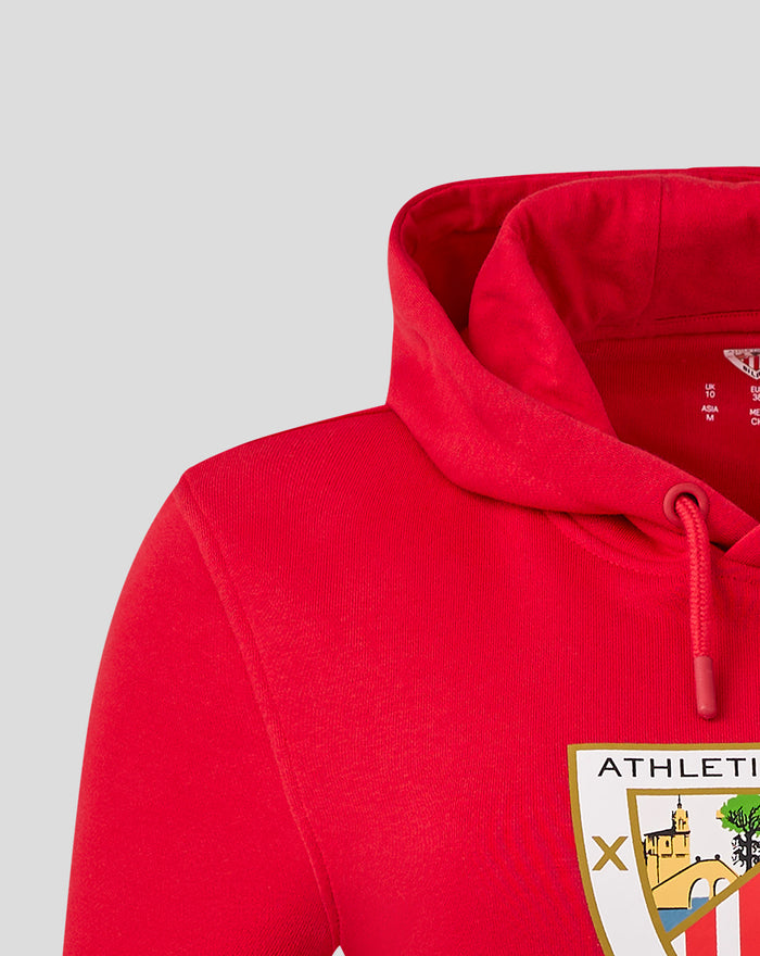 Close-up of red hoodie showing hood and partial crest emblem