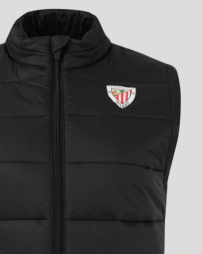 Black women's core gilet with a high padded collar and front zipper featuring a left chest crest patch.