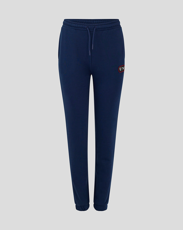 Navy women's club jogger with drawstring waist and small logo patch on the hip.