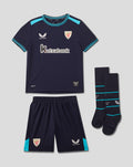 Infant navy Athletic Club away kit laid out showing back of shirt with crest near neck, turquoise trim and side panels, matching shorts with crest and Castore logo, socks