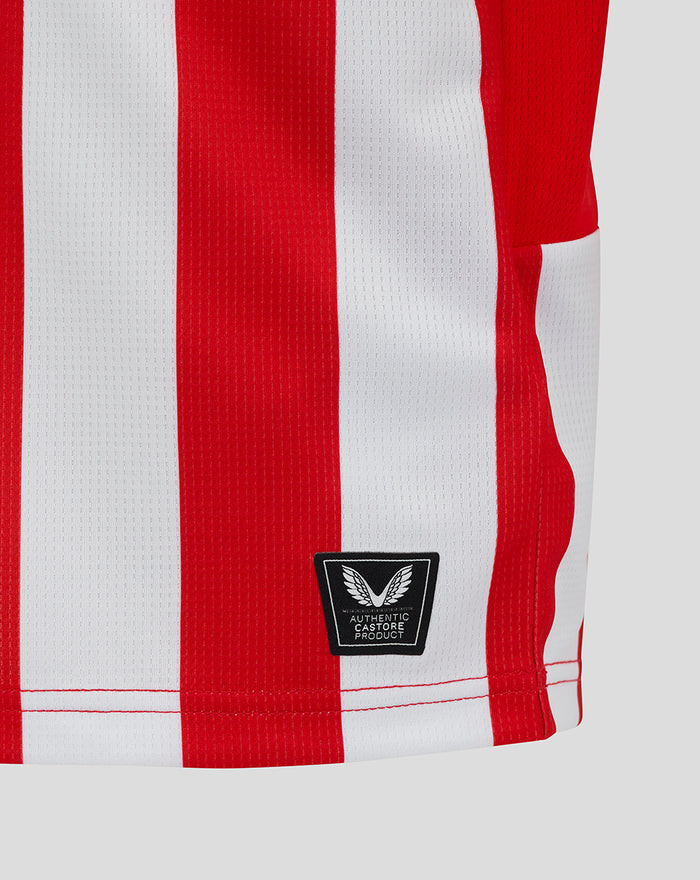 Close-up of red and white striped fabric on Athletic Club junior home shirt with Castore patch.
