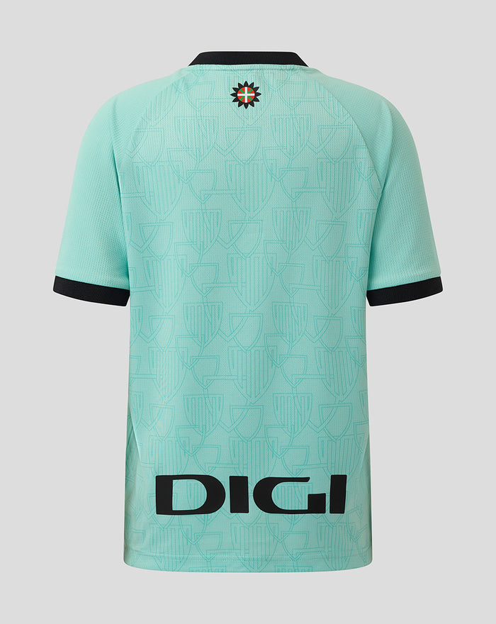 Back view of turquoise junior Athletic Club Third Short Sleeve Shirt with a crest at the upper back and bold branding along the hem.