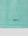 Close-up of turquoise AerTek fabric showing a subtle crest pattern and neat hem stitching.