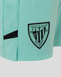 Turquoise junior Athletic Club third shorts close up with Castore logo on left thigh and crest on right thigh