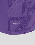 Close-up of purple fabric displaying AerTek patch and diagonal pattern near the hem of the jersey.