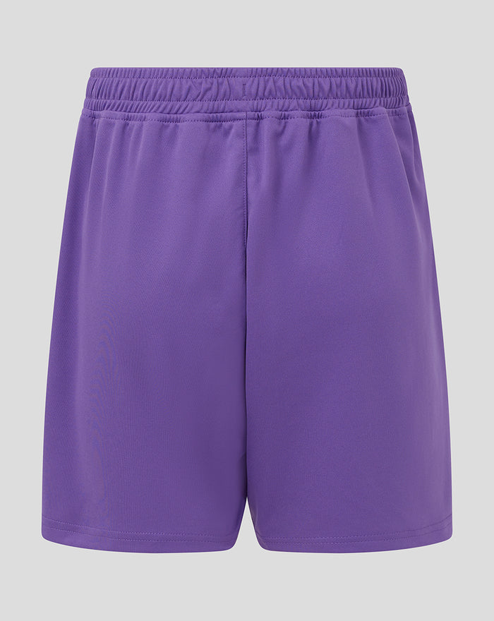 Purple junior goalkeeper shorts with embroidered Castore logo on the left thigh and Athletic Club crest on the right thigh