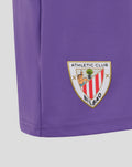 Close up of purple junior goalkeeper shorts showing the Athletic Club Bilbao crest on the lower side