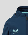 Close-up of navy junior shower jacket with light blue wing crest and Castore branding on the zipper pull