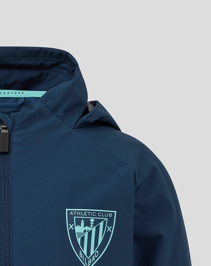 Front view of navy athletic club packable hooded jacket with left chest crest and turquoise collar trim