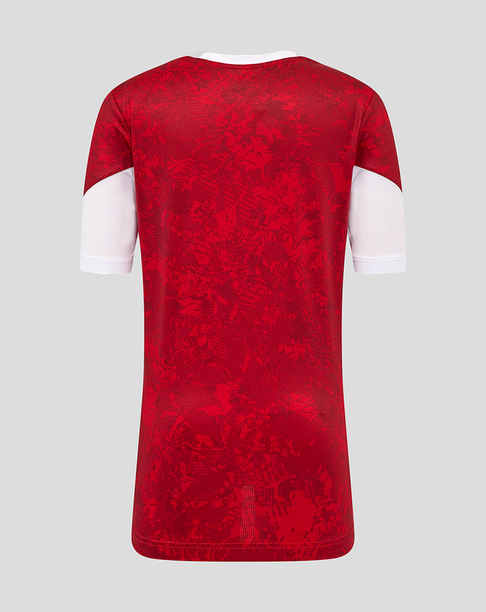 Back view of junior Athletic Club Home Pre Match Short Sleeve Tee with red pattern and white sleeve panels.