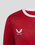 Red junior Athletic Club Home Pre Match tee with white collar trim and Castore logo and Athletic Club crest.