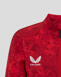 Close-up of the red camo junior jacket chest showing Castore logo