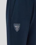 Navy jogger with Athletic Club crest on left thigh and cuffed hems