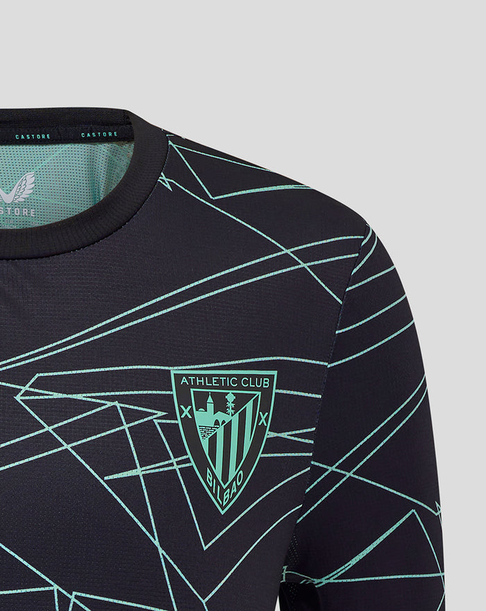 Close up of chest area on navy junior Athletic Club tee with turquoise crest and angular line pattern