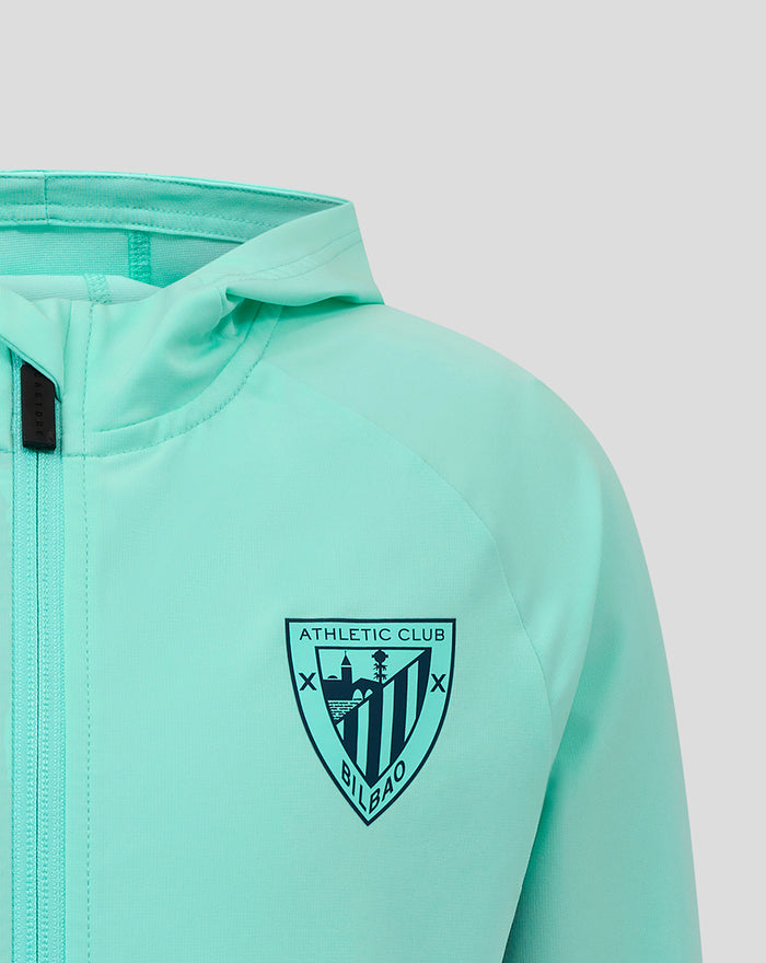 Athletic Club Bilbao crest on the left chest of the mint green jacket.