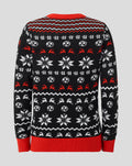 Back view of a black junior Athletic Club Christmas jumper with white snowflakes red reindeer motifs and red ribbed hem.