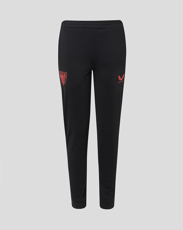 Front view of black junior Tech Fleece jog pants with red Athletic Club Bilbao crest on the left thigh and a red winged logo on the right thigh