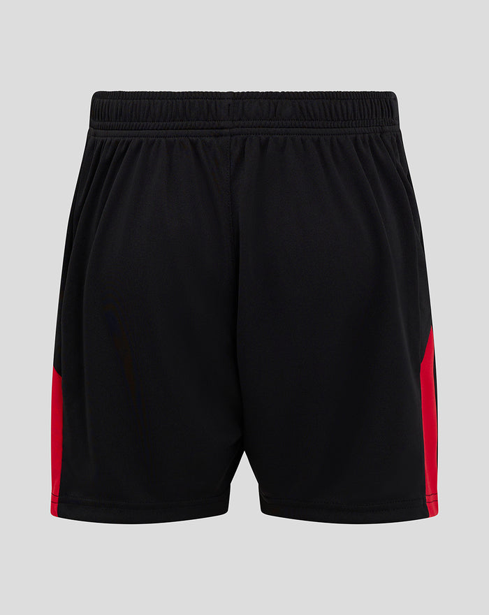 Back view of black Junior Athletic Club home shorts with red side panels