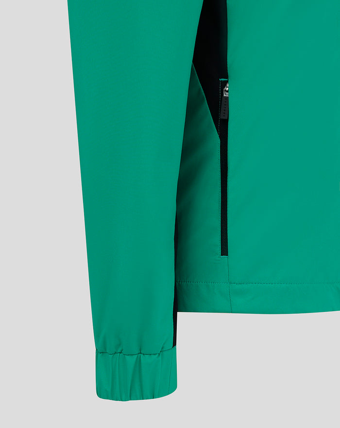 Teal green jacket with a vertical black zip pocket and black side panels.