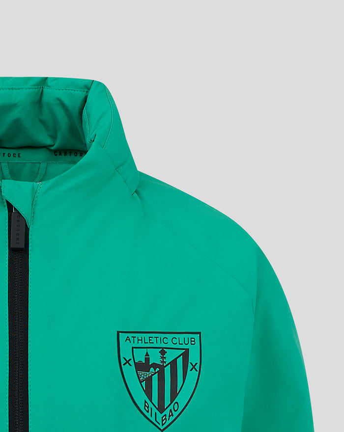 Close-up of green rain jacket showing the Athletic Club Bilbao crest on the chest.