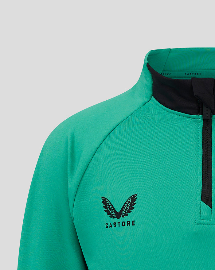Close up of teal junior 1/4 zip training top collar with black zip and Castore logo on chest.