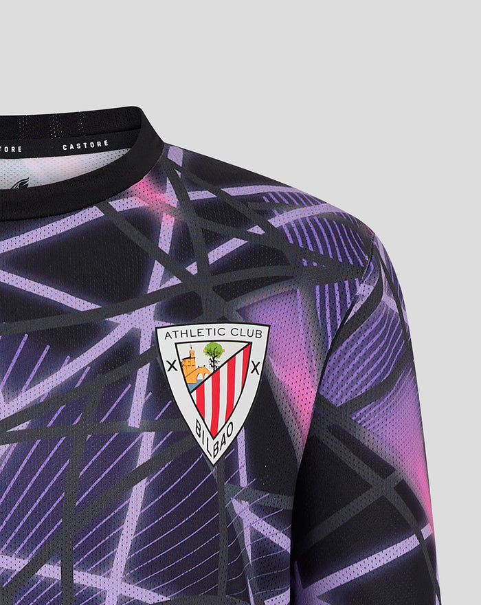 Close-up of JUNIOR THIRD MATCHDAY T-SHIRT 24/25 with purple and black geometric pattern and the team crest on the chest.