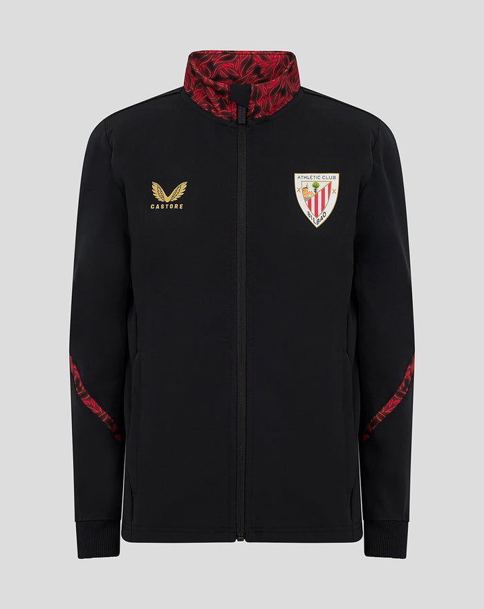 Front view of black junior matchday anthem jacket with red patterned collar and sleeve panels and team crest on chest.