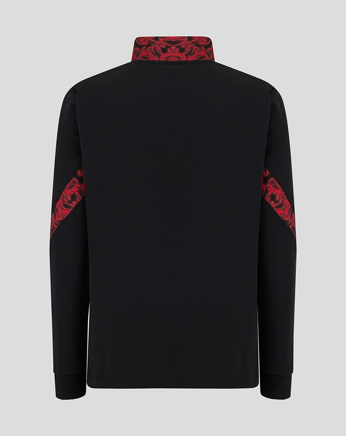 Back view of black junior matchday anthem jacket showing red patterned sleeve panels.